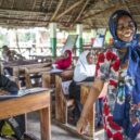 Local instructor in a coastal, open-air classroom, representing cultural immersion and educational internships abroad.