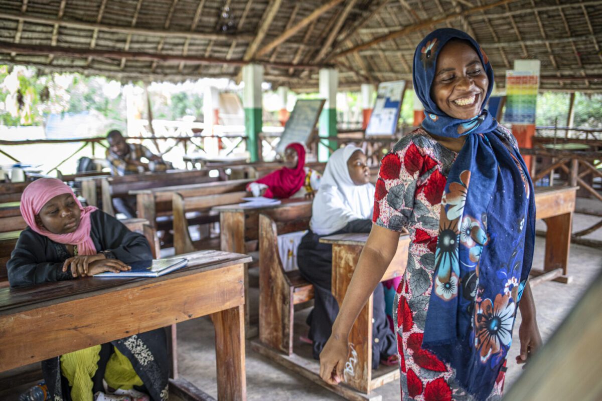 Local instructor in a coastal, open-air classroom, representing cultural immersion and educational internships abroad.